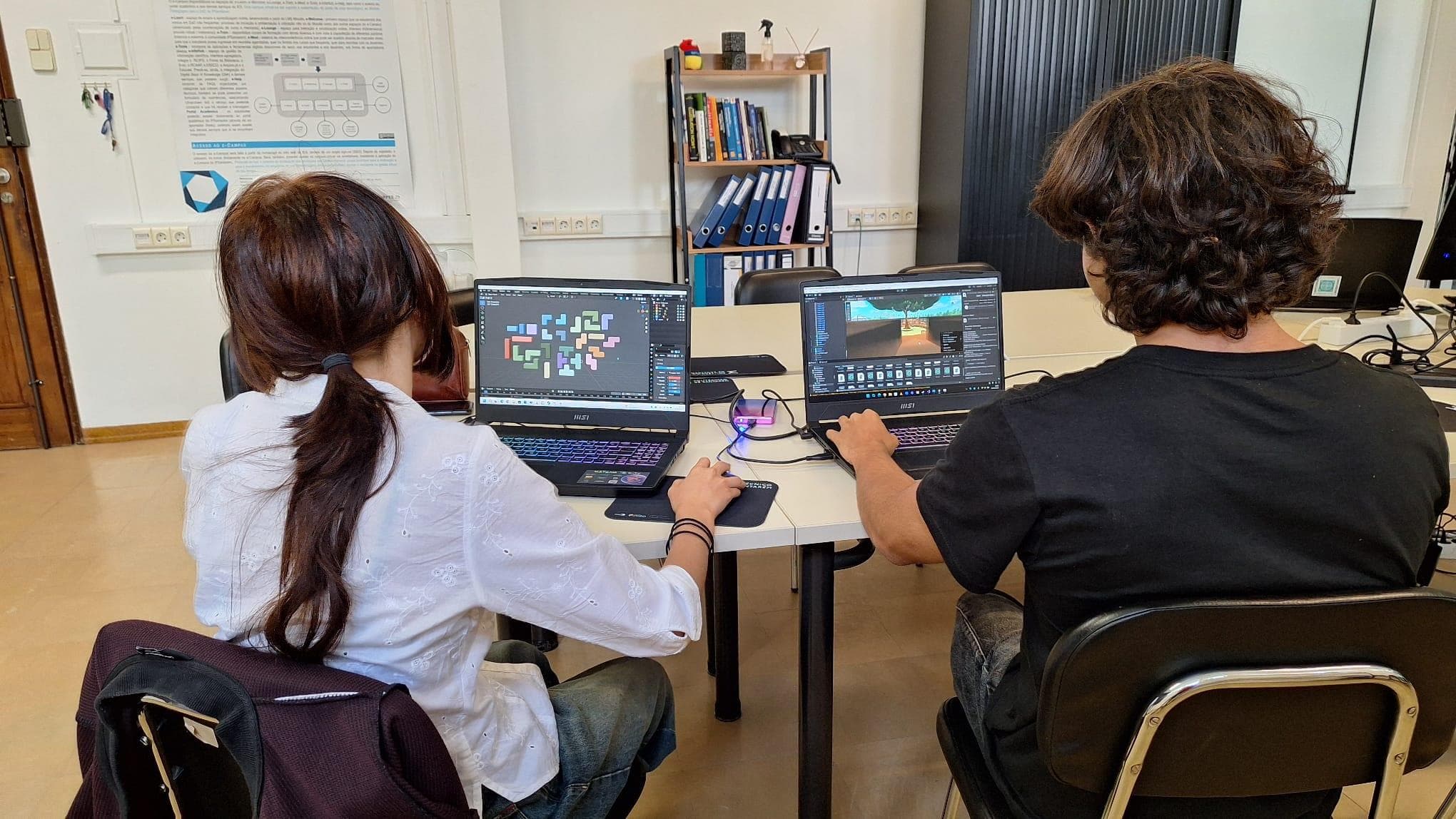 Diana Santos and João Andrade working side by side on E-Lounge in Unity and Blender