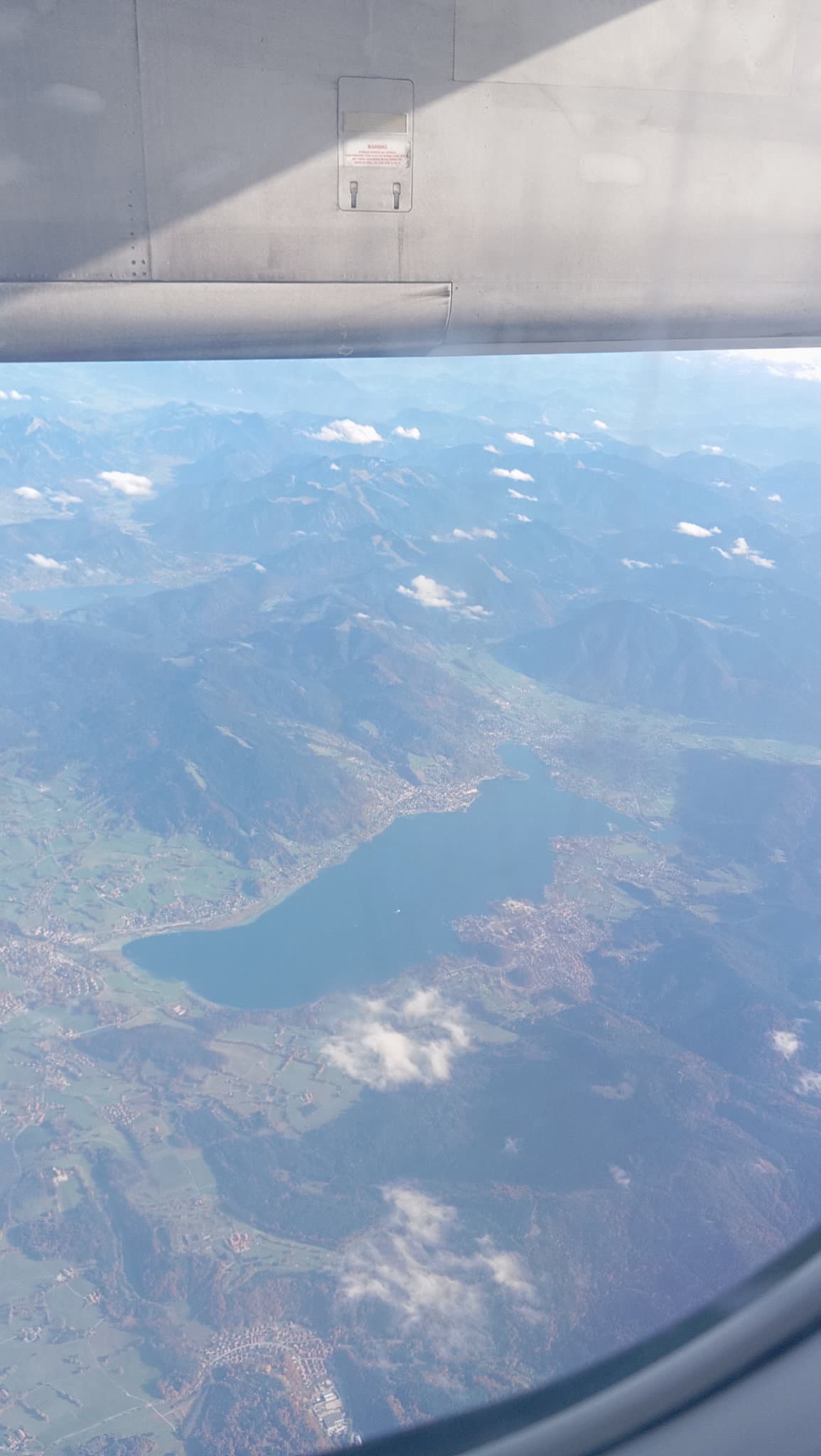 Aerial view of mountains and a lake from an aeroplane